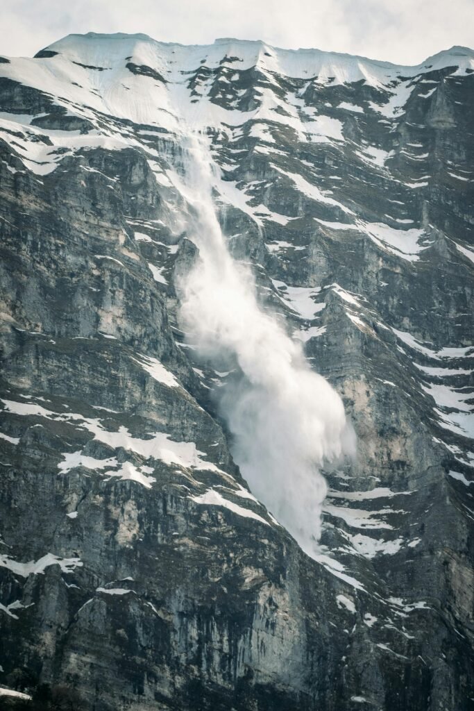 Dramatic avalanche rolling down a snow-covered mountain in Gjirokastër, Albania.